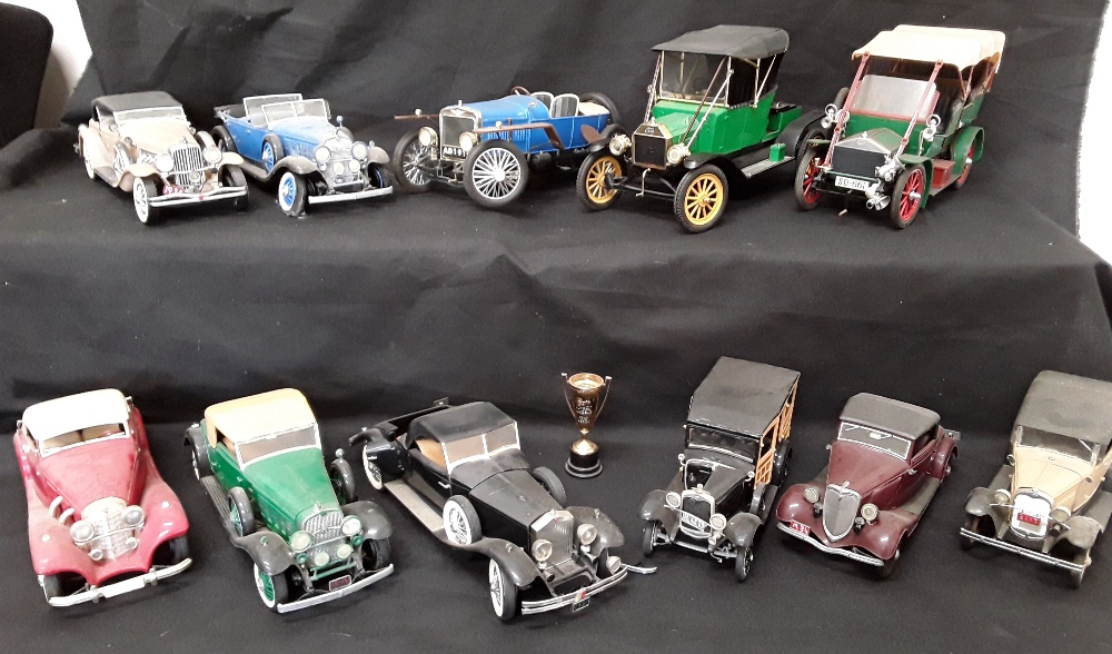 Two boxes of assorted's collectorsplastic model cars .