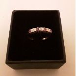9ct yellow gold ring set with 4 rubies and 3 diamonds. Weight 1.57g. Ring size R