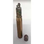 A WW2 inert cannon shell converted into a petrol table lighter. Dated 1942 to the base.