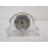 A small cut glass mantel clock.