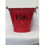A red railway fire bucket.