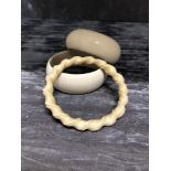 A set of three ivory bracelets of different forms.