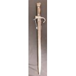 A 19th Century French sabre bayonet with brass hilt in its steel scabbard. Dated 1868 to blade.