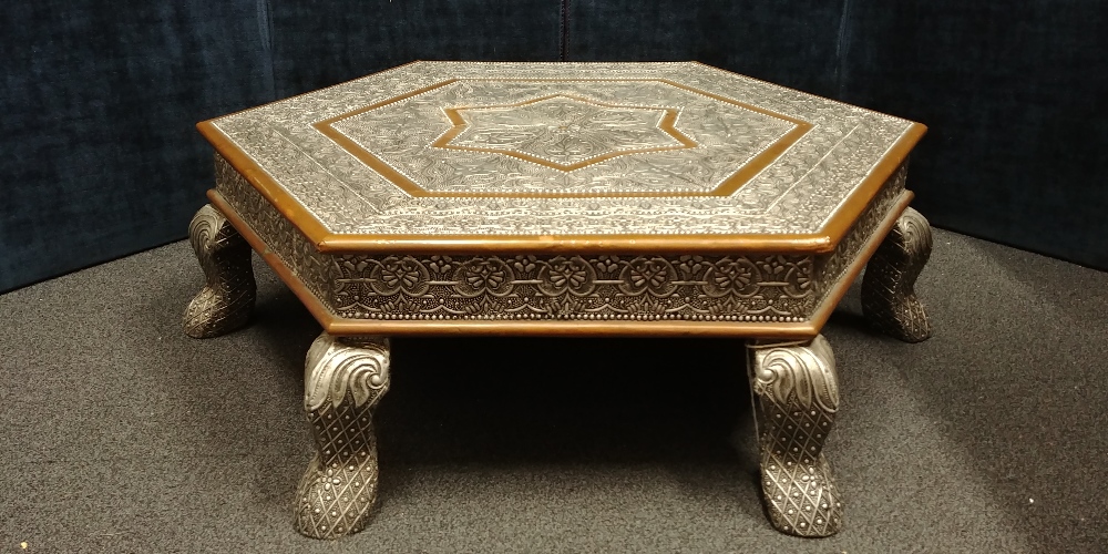 An Indian hexagonal silver and copper wrapped coffee table of larger proportions.