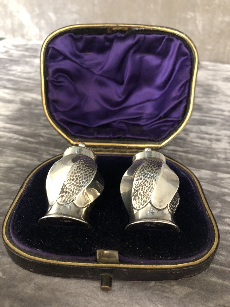 A pair of silver salt and pepper shakers. Hallmarked Birmingham 1981, maker's mark S.L. In original