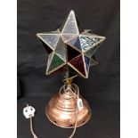 A Tiffany style lamp with copper stand supporting a coloured glass star lamp.