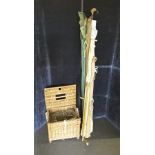 A 1950’s/60’s fishing basket and rods (six in total) plus reels and floats, etc.