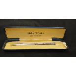 A solid silver pencil marked Yard of Lead. In original presentation case.