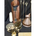 A large collection of brass items to include kettles, a scuttle, fire forks, a crib board, etc.
