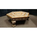 An Indian hexagonal silver and copper wrapped coffee table of small proportions.