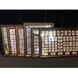 A set of framed and glazes cigarette cards in six sets including birds, ships, religious icons etc.