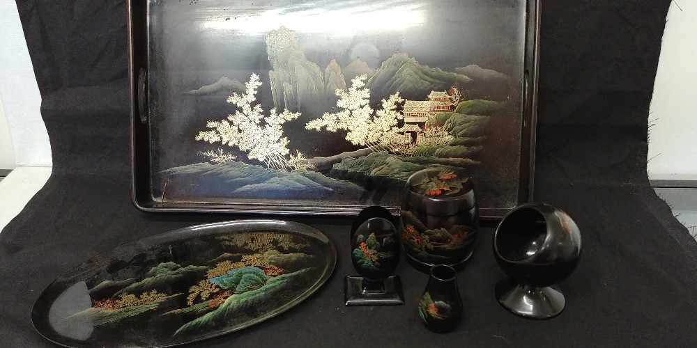 A black lacquered desk set in the chinoissiere style.