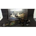 A black lacquered desk set in the chinoissiere style.