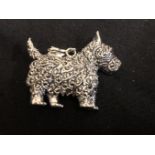 A silver and marcasite necklace pendant in the form of a Scottie dog.