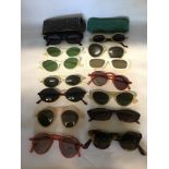 14 pairs of vintage lady's sunglasses including "Cutler and Gross" of London and Kenzo.
