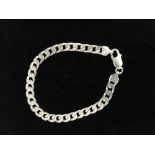 A solid silver curb link bracelet.