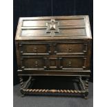 An antique drop leaf bureau.