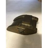 A solid bronze WW1 tank 8cms long and weighing in excess of 600 grams.