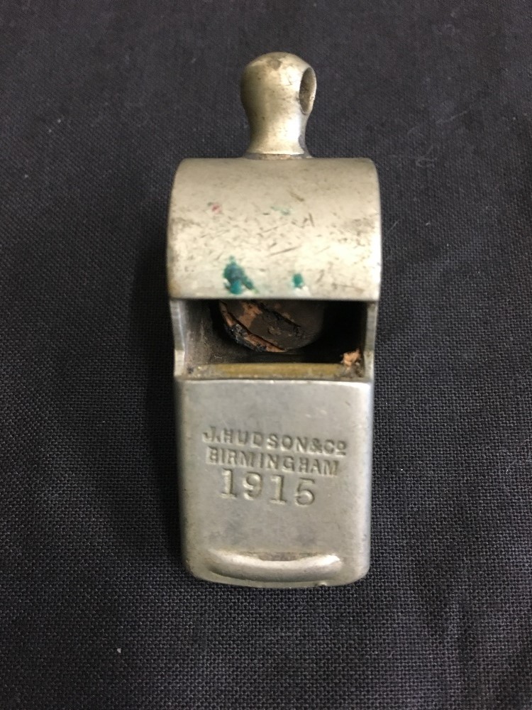 A whistle by J. Hudson & Co. of Birmingham dated 1915.