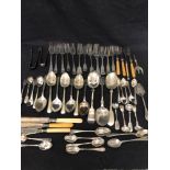 A large assortment of silver plated flatware.