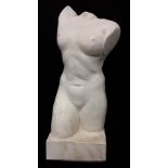 A ceramic sculpture of a female torso.