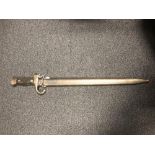 A 19th century French model 1892 bayonet with wooden grips and hooked quillon in its steel scabbard.