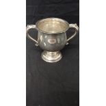A silver twin handled trophy hallmarked Birmingham 1932, maker TS.