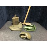 An entrenching tool together with other military items