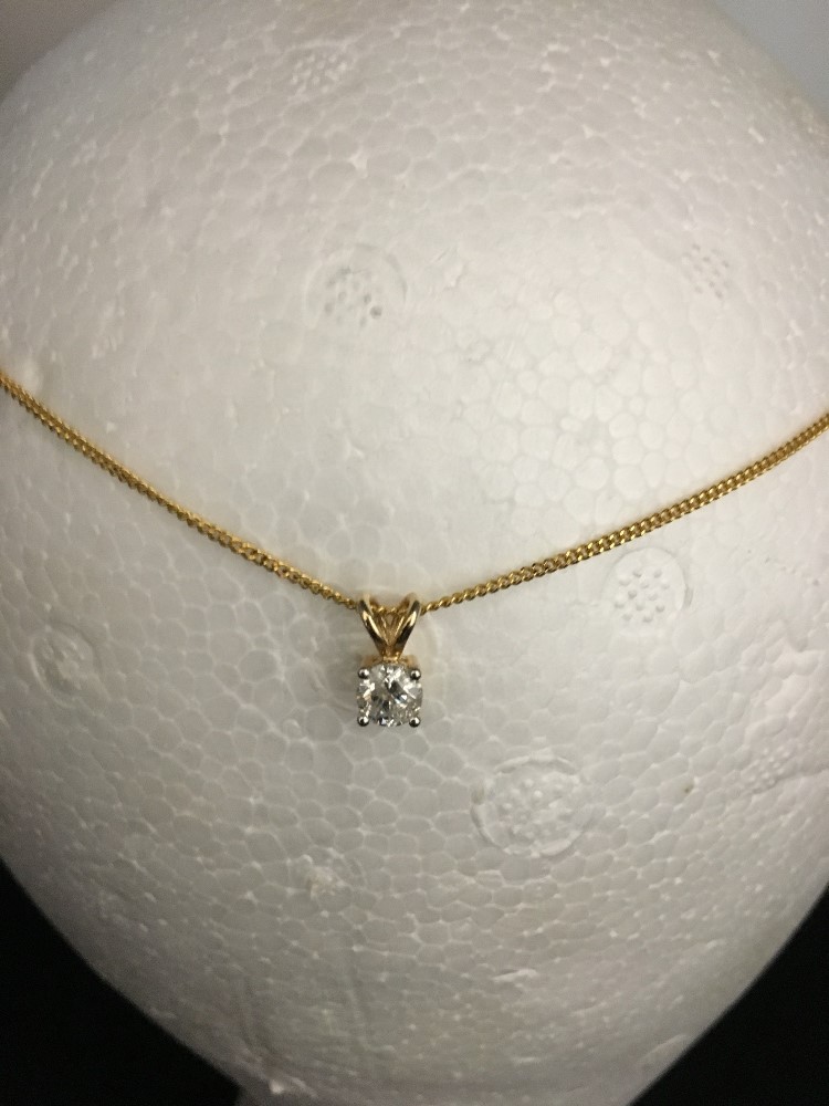 A 9ct yellow gold chain and pendant. The pendant set with a solitaire diamond. - Image 2 of 3