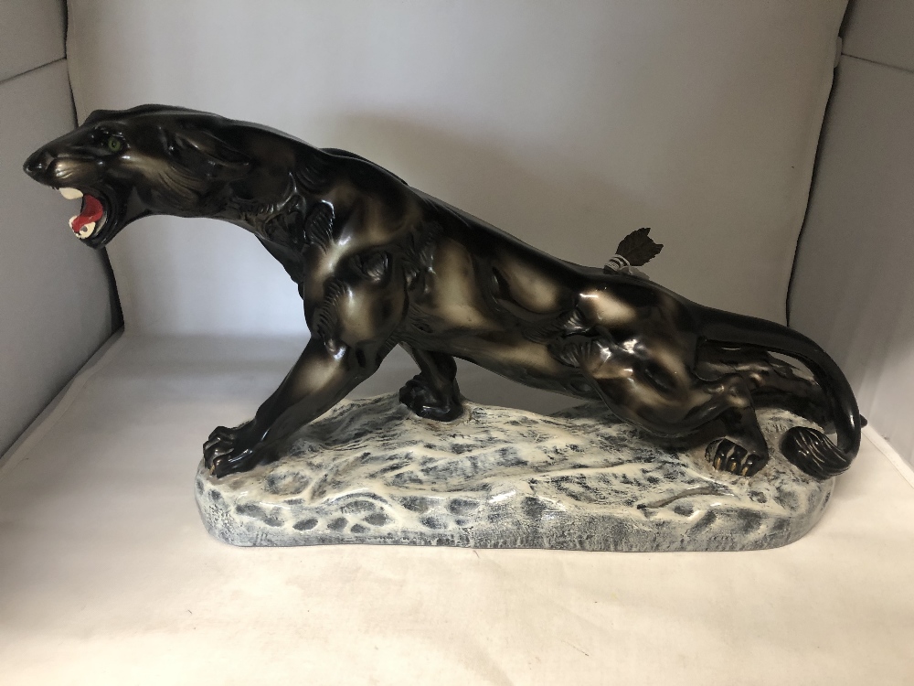 A large Art Deco puma with arrow in the back, signed by the artist H. Morigevin.