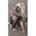 A heavy resin elephant.