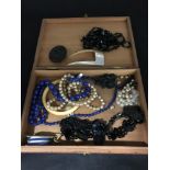 An assortment of costume jewellery including mother of pearl hair decoration, faux pearls etc.
