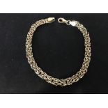 A 9ct gold bracelet of unusual articulated form.