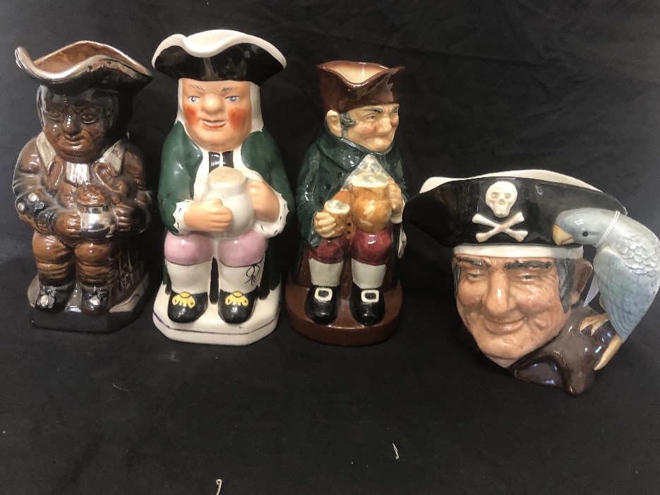 A set of four toby jugs.