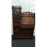 An Art Nouveau oak cabinet and writing slope.