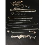 A large assortment of silver including rings necklaces and bracelets