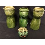 A collection of four pieces of Farnham Pottery - three jugs and an ornament in the form of people.