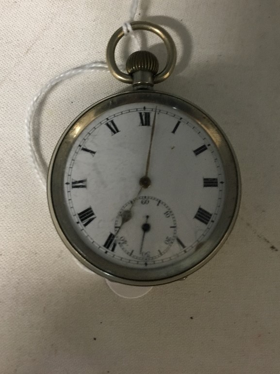 A white metal pocket watch with white enamel face.