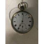 A white metal pocket watch with white enamel face.