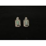 A pair of silver earrings set with CZ and opaline panels.