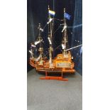 A wooden model of a fully rigged three masted Dutch galleon.