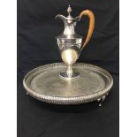 A silver plated claret jug together with a silver plated galleried tray.