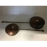 Two miniature copper bed warmers. Being sold on behalf of The Salvation Army.