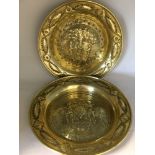 Two brass wall hanging plates. Diameter 41cm. Depicting religious scenes.