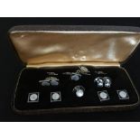 A set of white metal and mother of pearl gent's cufflinks and tiepin. In original box.