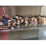 A very large collection of miniature toby jugs by various makers.