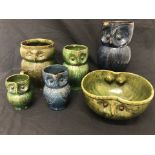 A collection of owl jugs and an owl bowl by Farnham Pottery.