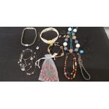 An assortment of costume jewellery including bracelets, earrings and necklaces.