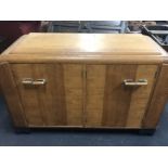 An Art Deco drinks sideboard in oak with six cupboards.