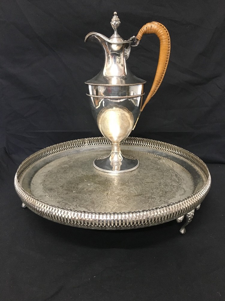 A silver plated claret jug together with a silver plated galleried tray.